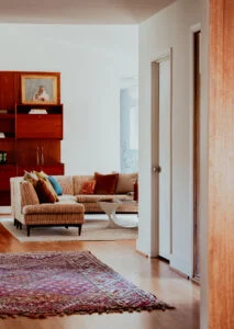Living room shelves styled with books and collected pieces in a Providence home by Hayden Home Studio